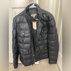 Brand new. Never been worn. Black leather puffer jacket.